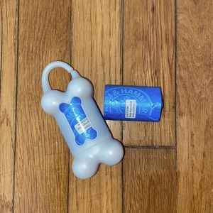 Dog waste bag dispenser and two rolls of bags